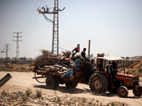 Palestinians are walking on Salah El Din Street in Deir al-Balah in the central Gaza Strip on July 3, 2024, amid the ongoing conflict betwee...