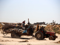 Palestinians are walking on Salah El Din Street in Deir al-Balah in the central Gaza Strip on July 3, 2024, amid the ongoing conflict betwee...