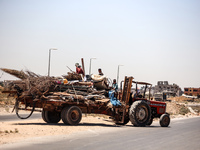 Palestinians are walking on Salah El Din Street in Deir al-Balah in the central Gaza Strip on July 3, 2024, amid the ongoing conflict betwee...