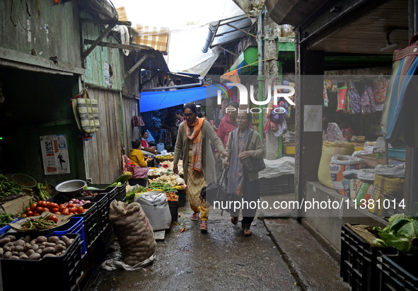 People are being seen in a vegetable market in Darjeeling, India, on July 2, 2024. Darjeeling is being known as a famous tourist destination...