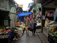 People are being seen in a vegetable market in Darjeeling, India, on July 2, 2024. Darjeeling is being known as a famous tourist destination...