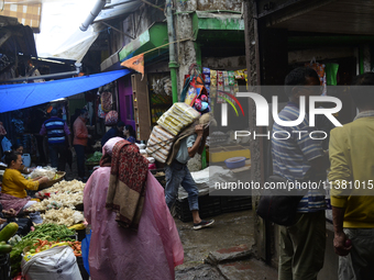 People are being seen in a vegetable market in Darjeeling, India, on July 2, 2024. Darjeeling is being known as a famous tourist destination...