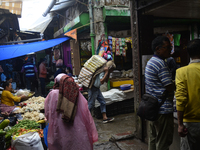 People are being seen in a vegetable market in Darjeeling, India, on July 2, 2024. Darjeeling is being known as a famous tourist destination...