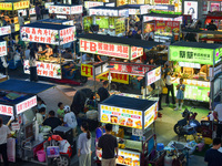 Citizens are enjoying food and leisure time at a night market in Nanjing, China, on July 3, 2024. (