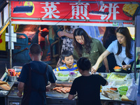 Citizens are enjoying food and leisure time at a night market in Nanjing, China, on July 3, 2024. (