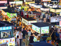 Citizens are enjoying food and leisure time at a night market in Nanjing, China, on July 3, 2024. (