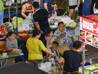 Citizens are enjoying food and leisure time at a night market in Nanjing, China, on July 3, 2024. (