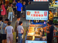 Citizens are enjoying food and leisure time at a night market in Nanjing, China, on July 3, 2024. (