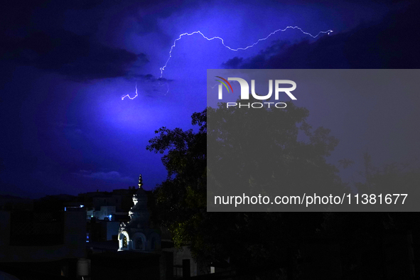 Lightning is flashing through the sky over Ajmer during the monsoon showers in Ajmer, Rajasthan, India, on July 4, 2024. 