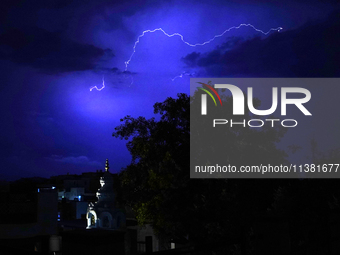 Lightning is flashing through the sky over Ajmer during the monsoon showers in Ajmer, Rajasthan, India, on July 4, 2024. (