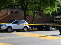 A vehicle is being damaged as a result of the shooting at the crime scene. Two people are being shot in Paterson, New Jersey, United States,...