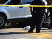 A vehicle is being damaged as a result of the shooting at the crime scene. Two people are being shot in Paterson, New Jersey, United States,...