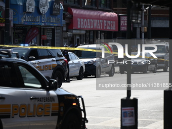 Paterson police are investigating the crime scene. Two people are being shot in Paterson, New Jersey, United States, on July 3, 2024, Wednes...