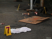 Evidence markers are being placed at the crime scene by the New York City Police Department Crime Scene Unit. One person is being assaulted,...