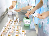 A doctor of acupuncture and massage is making ''Sanfu paste'' at a Traditional Chinese Medicine hospital in Chongqing, China, on July 3, 202...