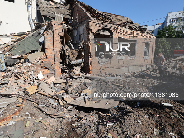 A building in a residential area is being destroyed by the Russian glide bomb attack in Kharkiv, Ukraine, on July 3, 2024. At about 4 pm on...