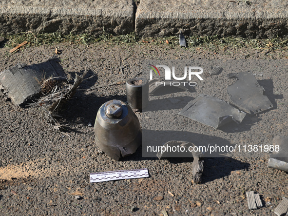 Fragments of a Russian projectile are being collected in a residential area after the Russian glide bomb attack in Kharkiv, Ukraine, on July...