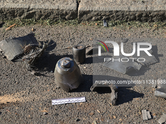 Fragments of a Russian projectile are being collected in a residential area after the Russian glide bomb attack in Kharkiv, Ukraine, on July...