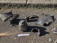 Fragments of a Russian projectile are being collected in a residential area after the Russian glide bomb attack in Kharkiv, Ukraine, on July...