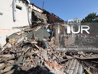 A building in a residential area is being destroyed by the Russian glide bomb attack in Kharkiv, Ukraine, on July 3, 2024. At about 4 pm on...