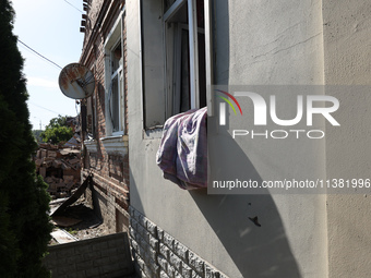 A building in a residential area is being destroyed by the Russian glide bomb attack in Kharkiv, Ukraine, on July 3, 2024. At about 4 pm on...