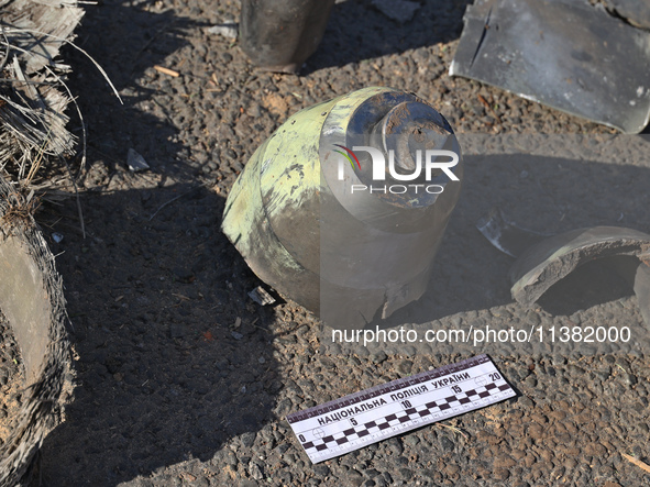 Fragments of a Russian projectile are being collected in a residential area after the Russian glide bomb attack in Kharkiv, Ukraine, on July...