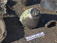 Fragments of a Russian projectile are being collected in a residential area after the Russian glide bomb attack in Kharkiv, Ukraine, on July...