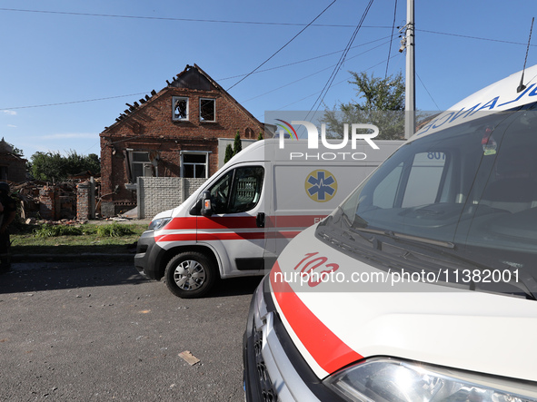 Ambulances are parking outside a house destroyed by the Russian glide bomb attack in Kharkiv, Ukraine, on July 3, 2024. At about 4 pm on Wed...