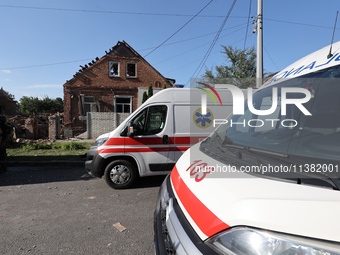 Ambulances are parking outside a house destroyed by the Russian glide bomb attack in Kharkiv, Ukraine, on July 3, 2024. At about 4 pm on Wed...