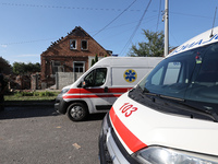 Ambulances are parking outside a house destroyed by the Russian glide bomb attack in Kharkiv, Ukraine, on July 3, 2024. At about 4 pm on Wed...