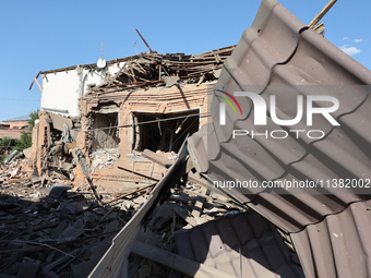 A building in a residential area is being destroyed by the Russian glide bomb attack in Kharkiv, Ukraine, on July 3, 2024. At about 4 pm on...