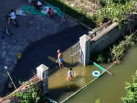 The water level of Shijiu Lake is rising after days of rainstorm, and some surrounding villages are flooding in Nanjing, China, on July 4, 2...