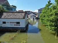 The water level of Shijiu Lake is rising after days of rainstorm, and some surrounding villages are flooding in Nanjing, China, on July 4, 2...