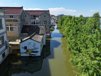 The water level of Shijiu Lake is rising after days of rainstorm, and some surrounding villages are flooding in Nanjing, China, on July 4, 2...