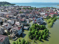 The water level of Shijiu Lake is rising after days of rainstorm, and some surrounding villages are flooding in Nanjing, China, on July 4, 2...