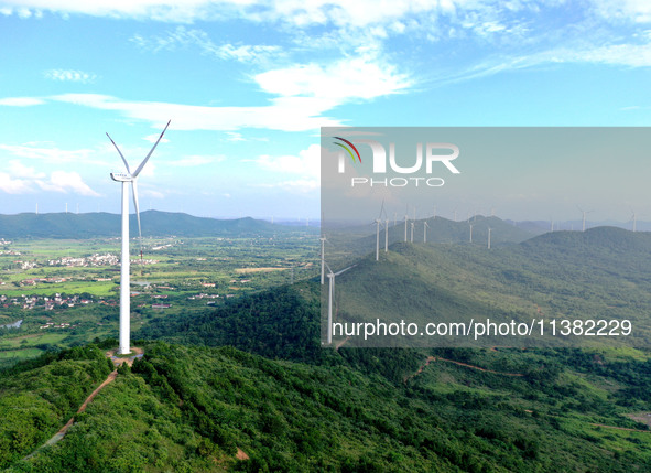 Wind turbines are operating at Chaohu Guanhu Wind Farm in Hualin town, Chaohu city, Anhui province, China, on July 3, 2024. 