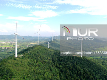 Wind turbines are operating at Chaohu Guanhu Wind Farm in Hualin town, Chaohu city, Anhui province, China, on July 3, 2024. (