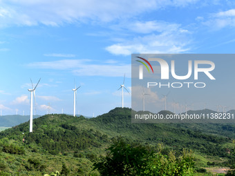 Wind turbines are operating at Chaohu Guanhu Wind Farm in Hualin town, Chaohu city, Anhui province, China, on July 3, 2024. (