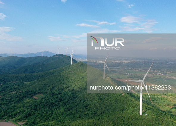 Wind turbines are operating at Chaohu Guanhu Wind Farm in Hualin town, Chaohu city, Anhui province, China, on July 3, 2024. 