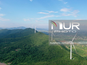 Wind turbines are operating at Chaohu Guanhu Wind Farm in Hualin town, Chaohu city, Anhui province, China, on July 3, 2024. (