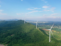 Wind turbines are operating at Chaohu Guanhu Wind Farm in Hualin town, Chaohu city, Anhui province, China, on July 3, 2024. (