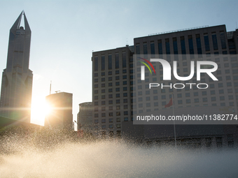 A water fountain from the People's Square is being seen in Shanghai, China, on July 4, 2024, as the temperature is reaching 39 degrees Celsi...