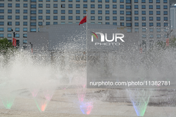 A water fountain from the People's Square is being seen in Shanghai, China, on July 4, 2024, as the temperature is reaching 39 degrees Celsi...