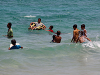 Displaced Palestinians are swimming next to a temporary camp in Khan Yunis, south of the Gaza Strip, on July 4, 2024, amid the ongoing confl...