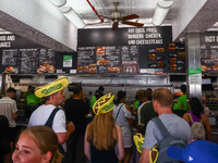 People are buying hot dogs during Nathan's Famous Hot Dogs Eating Contest which takes place annually at Coney Island on Independence Day in...