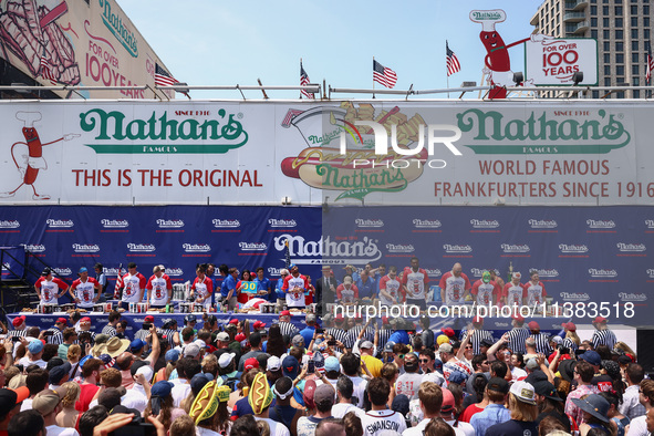 Contestants for the men's title during Nathan's Famous Hot Dogs Eating Contest which takes place annually at Coney Island on Independence Da...