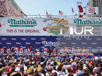 Contestants for the men's title during Nathan's Famous Hot Dogs Eating Contest which takes place annually at Coney Island on Independence Da...