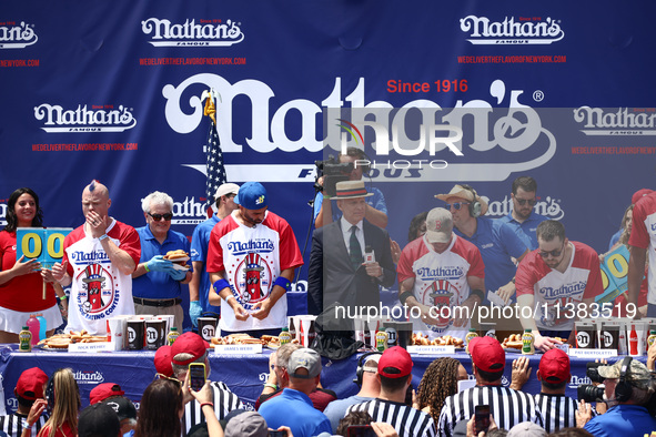 Contestants for the men's title during Nathan's Famous Hot Dogs Eating Contest which takes place annually at Coney Island on Independence Da...