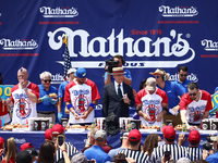 Contestants for the men's title during Nathan's Famous Hot Dogs Eating Contest which takes place annually at Coney Island on Independence Da...