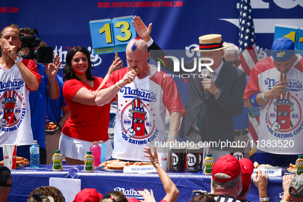 Contestants for the men's title during Nathan's Famous Hot Dogs Eating Contest which takes place annually at Coney Island on Independence Da...